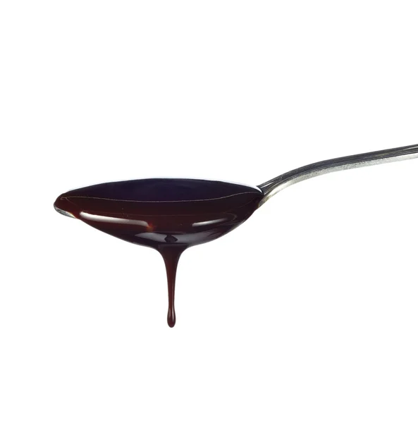 Sendok alat dapur Sirup coklat makanan bocor — Stok Foto
