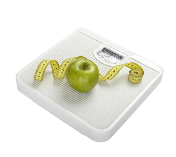 Rozsahu váhy měření pásky dietní ovoce potraviny jablko — Stock fotografie