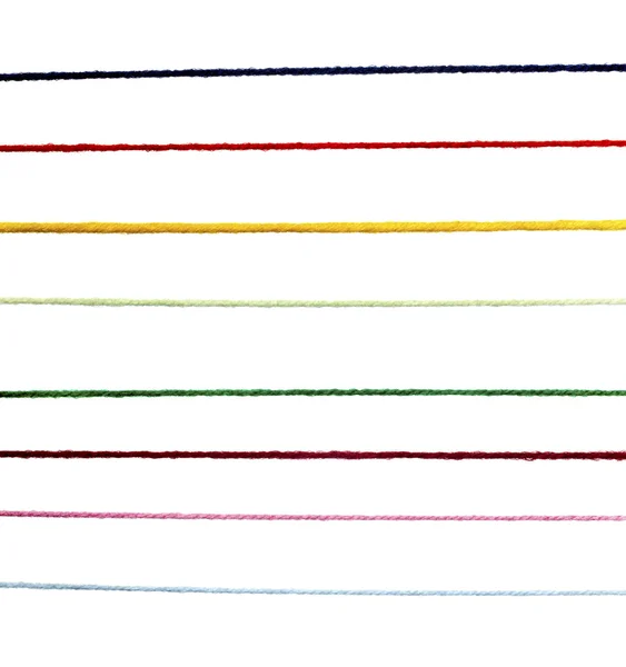 Wol breien tekenreeks snoer kleurrijke achtergrond — Stockfoto