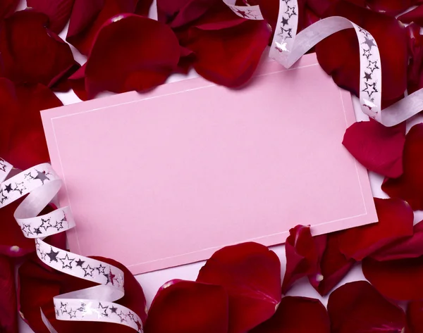 Поздравительная открытка лепестки роз празднование Рождества любовь Лицензионные Стоковые Изображения