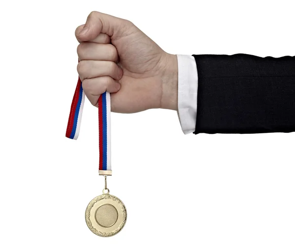 Бізнес рука тримає золоту медаль — стокове фото