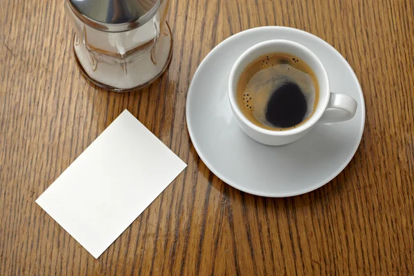 Boisson tasse de café et carte de note vierge — Photo