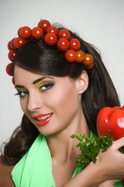 stock image Vegetarian girl with tomato on her head