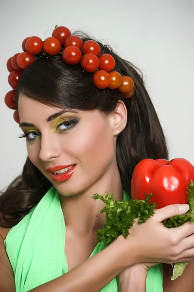 stock image Vegetarian girl with tomato on her head