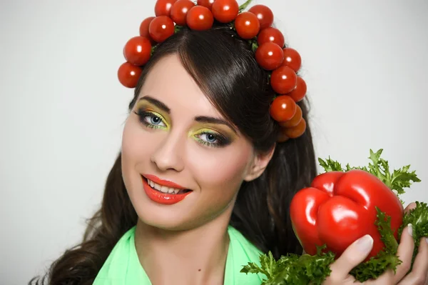 stock image Vegetarian girl with tomato on her head