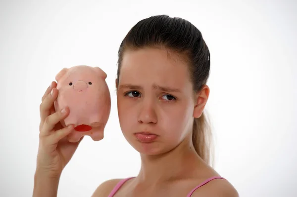 Adolescente menina chateado com porquinho banco — Fotografia de Stock