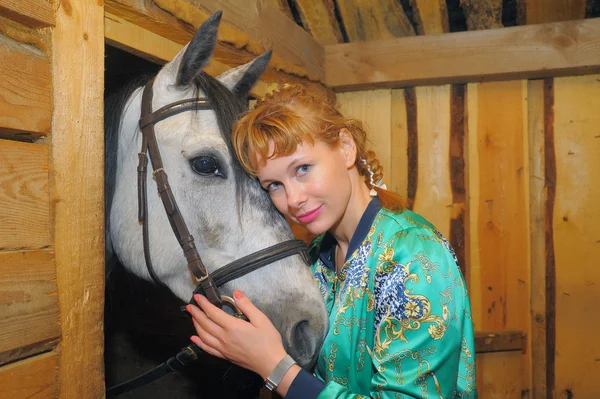 Girl in the stables — Stock Photo, Image