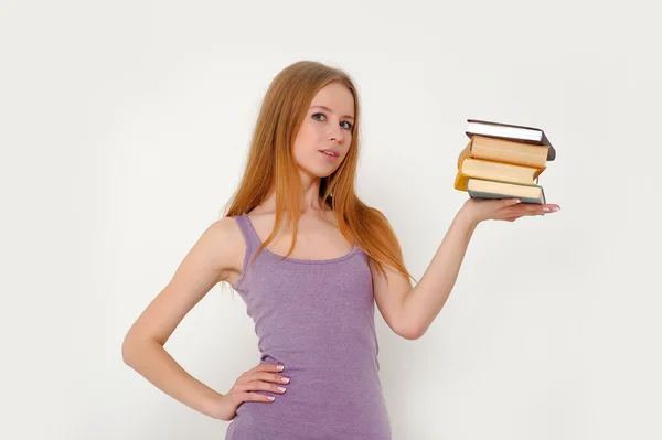Mujer joven con libros — Foto de Stock