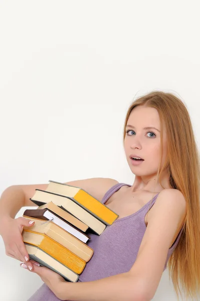 Jonge vrouw met boeken — Stockfoto