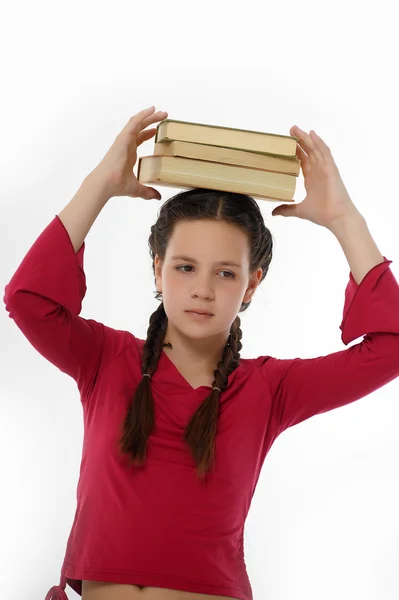그녀의 머리에 그녀의 책과 소녀 — 스톡 사진