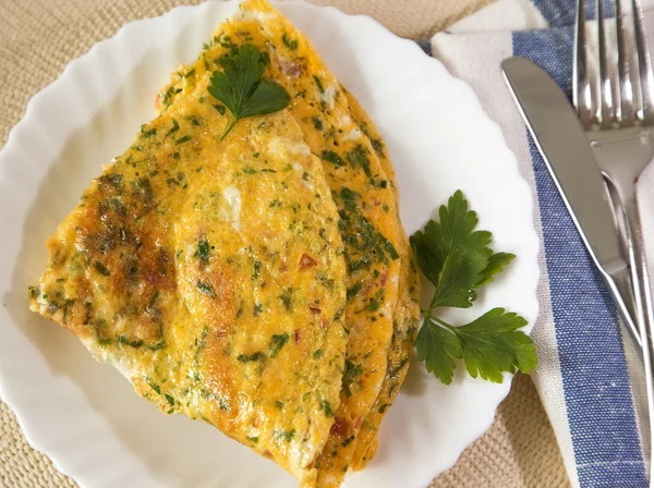 stock image Scrambled eggs with herbs. Omelet on white plate