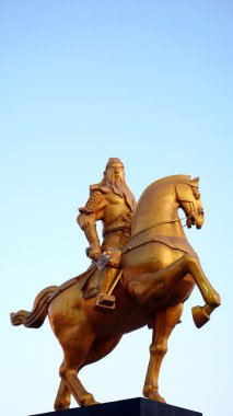 Ancient sculpture of Guangong on the horseback clipart