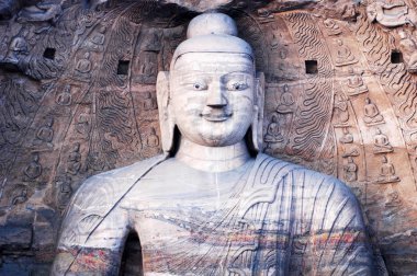 Giant buddha at Yungang Grottoes in Shannxi China clipart