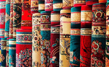 Persian blankets at a market clipart