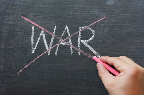 War - word crossed out with red chalk — Stock Photo, Image