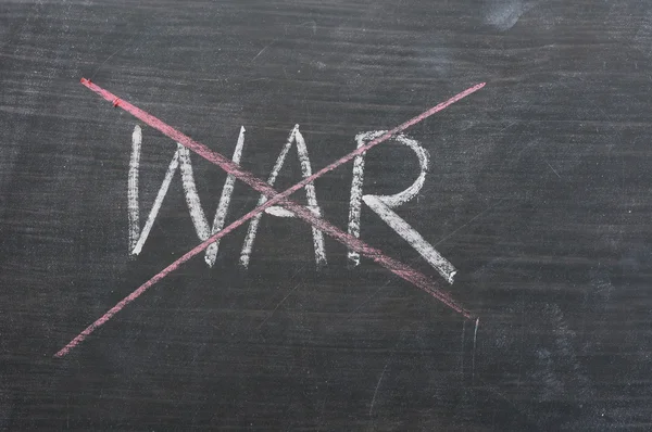 War - word crossed out with red chalk — Stock Photo, Image