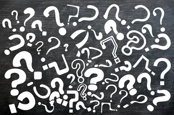 Various question marks on a blackboard — Stock Photo, Image