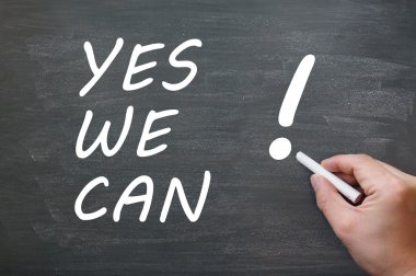 Yes we can - written with chalk on a blackboard clipart