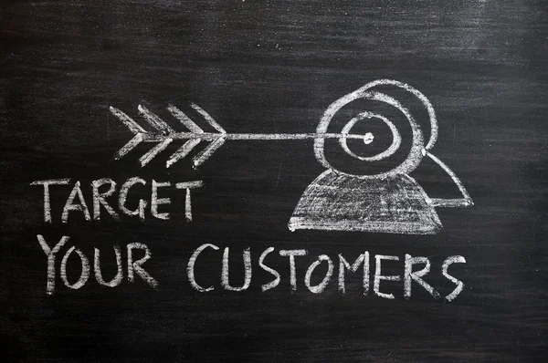 stock image 'Target your customers' concept drawn with white chalk on a blackboard