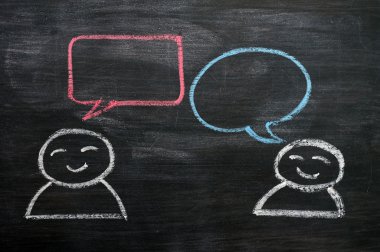 Blank speech bubbles with cartoon figures drawn on a blackboard background clipart