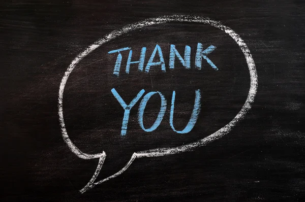Thank you written with blue chalk on a smudged blackboard — Stock Photo, Image