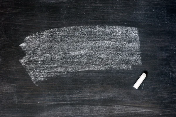Smudged blackboard background with chalk and copy space — Stock Photo, Image