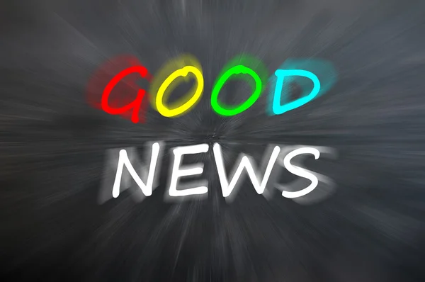 Dibujo de tiza de "Buenas noticias" en pizarra borrosa — Foto de Stock