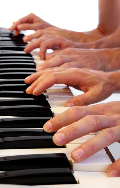 Seis mãos no piano de cauda — Fotografia de Stock