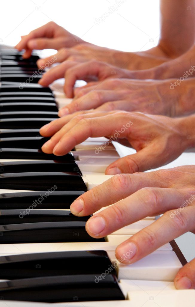 Six hands on grand piano