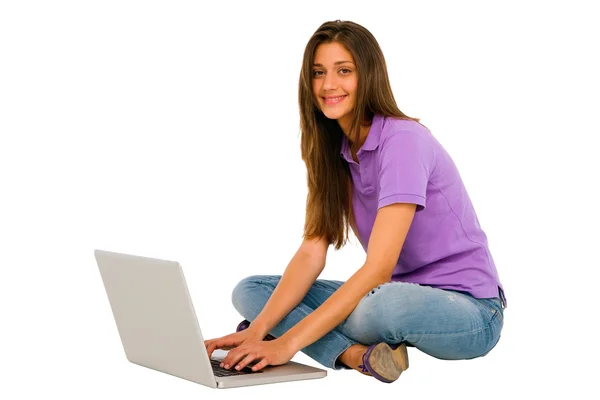Teenage girl using laptop — Stock Photo, Image
