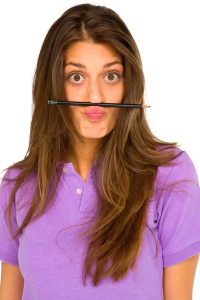 Tienermeisje balancing potlood op haar lip — Stok fotoğraf