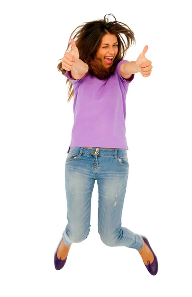 Zıplama yukarı başparmak ile genç kız — Stok fotoğraf