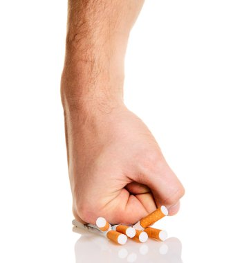 Man’s fist crushing cigarettes clipart