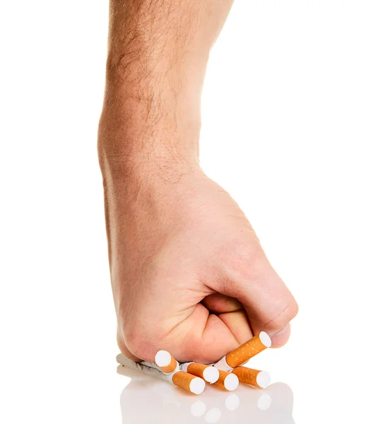 Muž? s pěst drcení cigarety — Stock fotografie