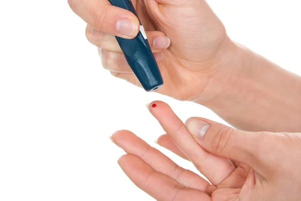 Diabetes lanceta na mão picada dedo pequeno sangue — Fotografia de Stock