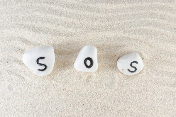 Слово SOS — стоковое фото