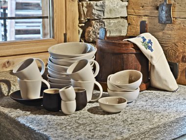 Detail of dishes on the marble in the rustic kitchen clipart