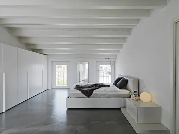 Modern bedroom in the attic room — Stock Photo, Image