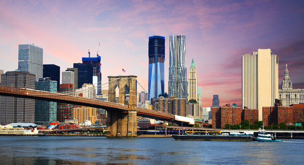 Brooklyn Bridge spans the East River towards Manhattan in New York City