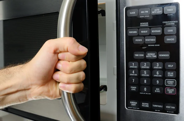 Hand Opening Microwave — Stock Photo, Image