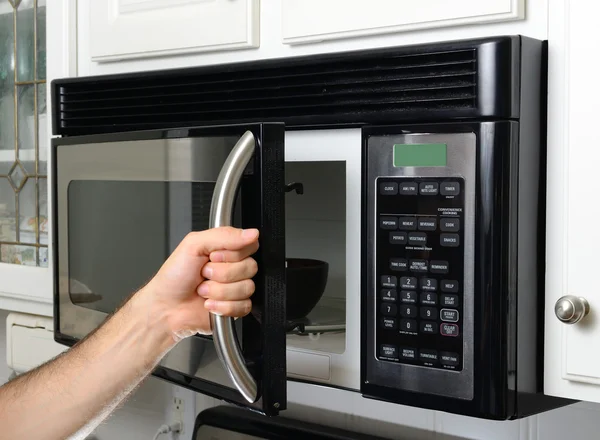 Hand Opening Microwave — Stock Photo, Image