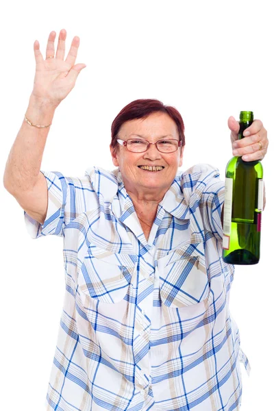 Elderly drunk woman with bottle of alcohol — Stock Photo, Image