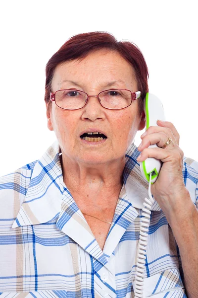 Schockierte Seniorin am Telefon — Stockfoto