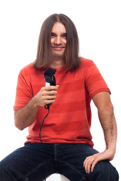 Feliz homem de cabelos longos com aparador de cabelo — Fotografia de Stock
