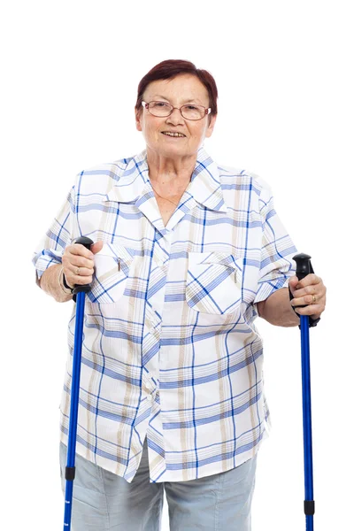 Happy senior woman with walking sticks — Stock Photo, Image