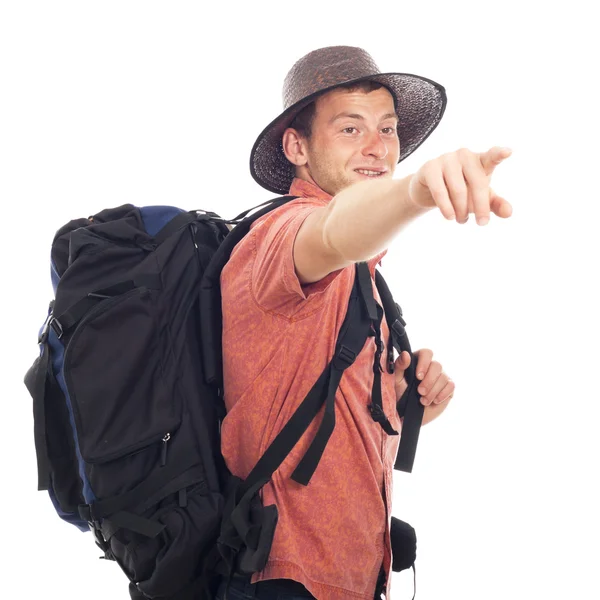 Backpacker wskazuje drogę — Zdjęcie stockowe