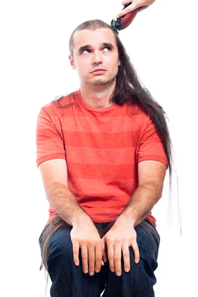 Unhappy long haired man being shaved — Stock Photo, Image