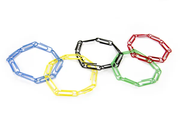 Concepto de unidad con anillos olímpicos vinculados por clips de papel —  Fotos de Stock