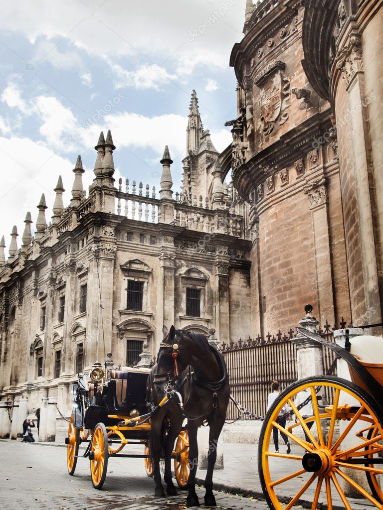 Cathedral of Seville with carrige horse, Spain