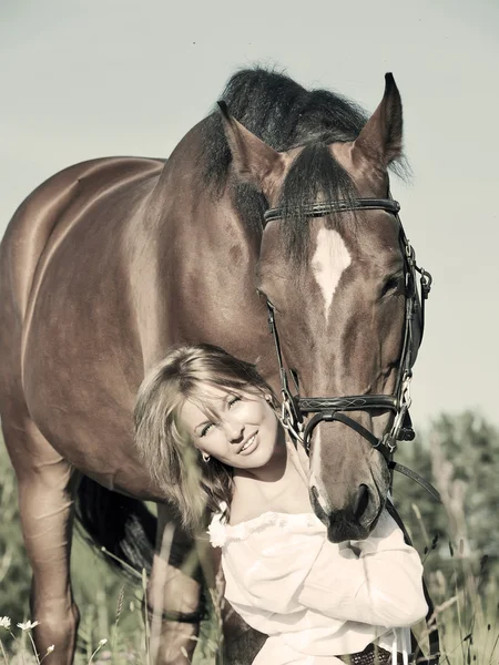 Nice girl with horse art toned — Stock Photo, Image